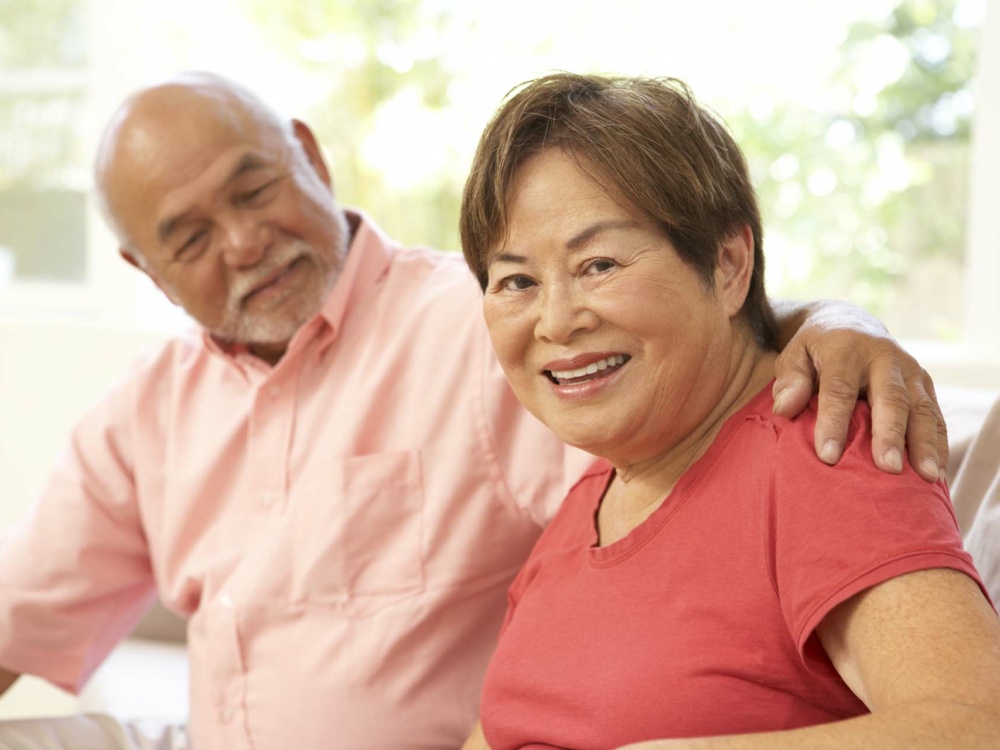 Senior Couple Relaxing At Home Together